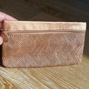 Beige/ gold metallic cosmetic bag.